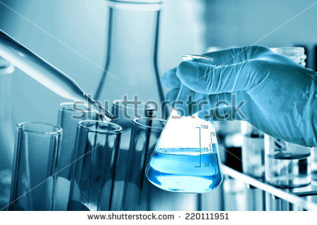 stock photo flask in scientist hand with dropping liquid to test tube 220111951